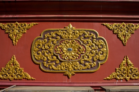 Laithai carved on red background.の写真素材