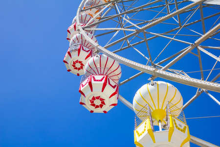 Ferris wheel with blue sky.