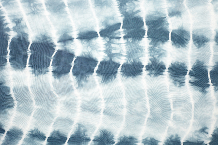Abstract tie dyed fabric backgroundの写真素材