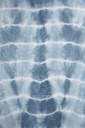 Abstract tie dyed fabric backgroundの写真素材