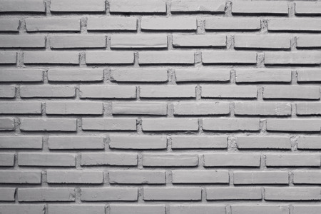 Grey brick wall background.