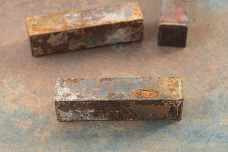 Macro of rusty metal bars on top of rusty metal table backgroundの写真素材