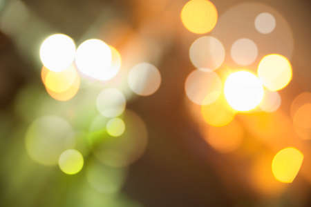 Abstract dark background with colorful bright bokehの写真素材