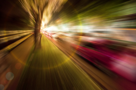 Abstract zoom blur of night scene road with strong light flare at apexの写真素材