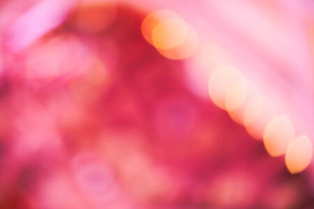Abstract blurry background with a lot of purple bokehの写真素材