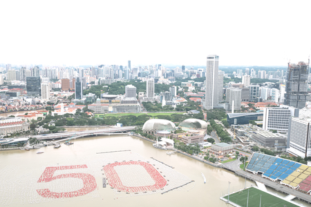 December 19, 2014 - Singapore: Singapore business zone cityscape with number 50 by using 20,000 white spheres and 5,000 red sphere over river to celebrate over 50 years of independenceのeditorial素材