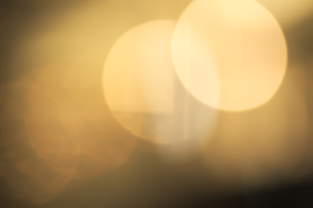 Abstract vivid yellow and white bokeh backgroundの写真素材