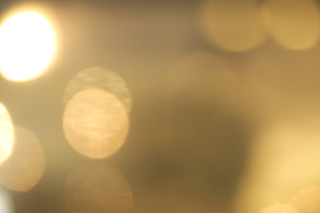Abstract vivid yellow and white bokeh backgroundの写真素材