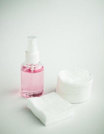 Protecting health from bacteria and viruses. Hand sanitizer, face mask and body thermometer.の写真素材