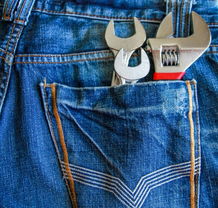 Mixed chrome wrench in jeans back pocketの写真素材