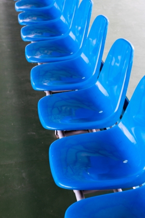 Blue plastic seats in the rowの写真素材