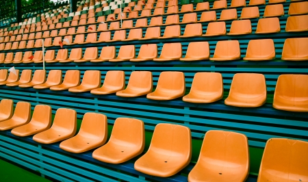 Orange empty plastic seats patternの写真素材