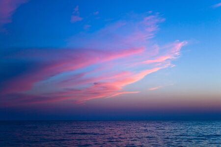 Sunset with beautiful clouds and seaの写真素材