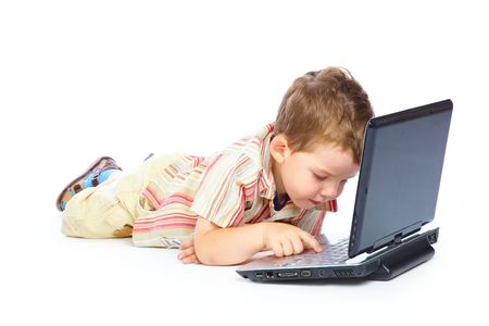 Concept of little businessman. Little child and laptop. Isolated on white backgroundの写真素材