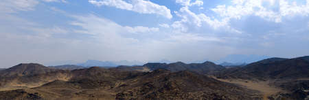 Panorama of desert and hills with blue skyの写真素材