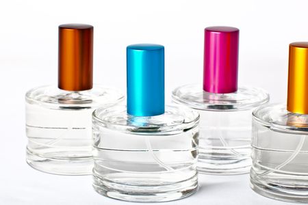 Four bottles with perfume. Isolated on white backgroundの写真素材