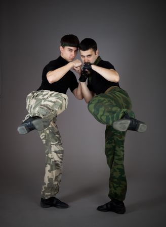 Two fighting man on gray backgroundの写真素材