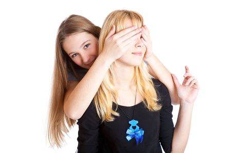 Two laugh teenage girls. Isolated on white backgroundの写真素材