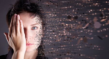 Young attractive woman on gray backgroundの写真素材