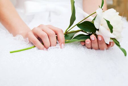 Bride with peony flower in handsの写真素材