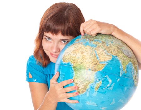 The red-haired girl with globe. Isolated on white background