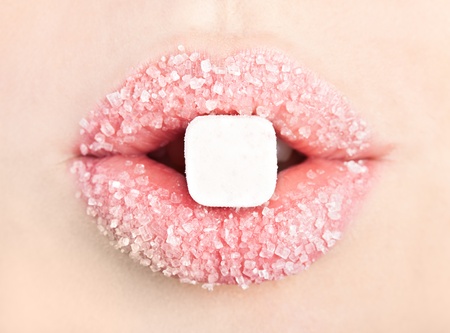 A lollipop in the mouth (close-up)の写真素材