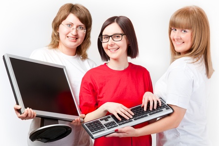 Women with a monitor and keyboard on grey backgroundの写真素材