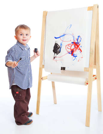A boy is drawing on a blackboardの写真素材