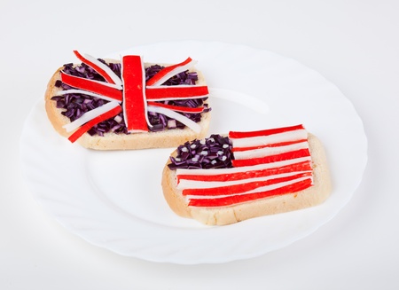 Sandwiches with flags of two countries on plateの写真素材