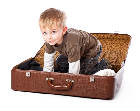 A funny boy in a suitcase. Isolated on a white backgroundの写真素材