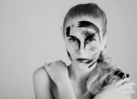 A woman with unusual make-up. Black and whiteの写真素材