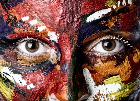 A colored woman's face in oil paintsの写真素材