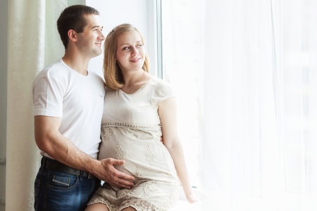 Happiness couple is posing  Woman is pregnantの写真素材