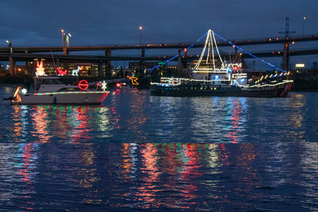 Boat in the port of Hamburg at night with lights and reflections