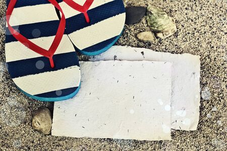 Beach background with flip flops, white paperの写真素材