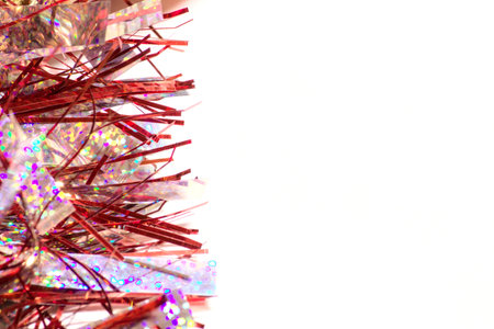 Christmas tinsel on white background with copy space for your text.