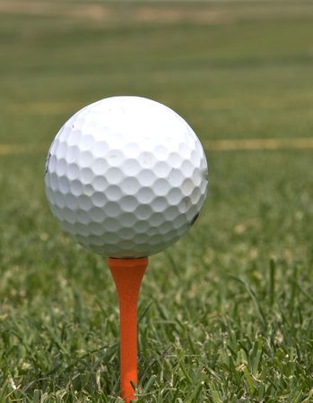 Golf Ball on Orange Teeの写真素材