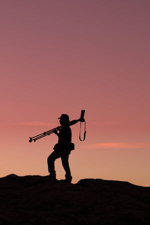 Photographer Silhouetted at Sunsetの写真素材