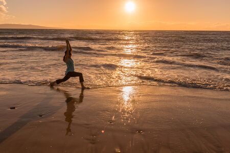 Yoga at Sunset on a Maui Beachの写真素材