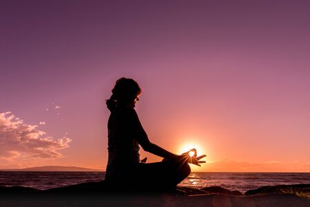 Yoga at Sunset on a Maui Beachの写真素材