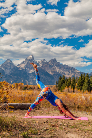 Practicing Yoga in the Tetons in Fallの写真素材