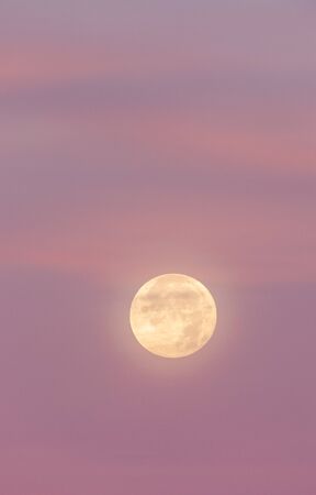 Full Moon Rising at Sunsetの写真素材