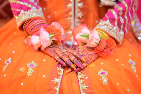 indian wedding tradition, closeup of hands with bridal accessoriesの写真素材