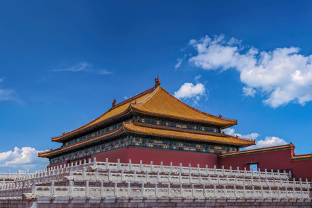 Side view of the majestic Hall of Supreme Harmony in Beijing's Forbidden City under a bright blue sky.の写真素材