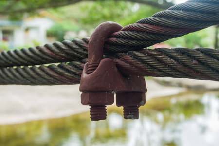 The screw clamp with the red steel sling.の写真素材