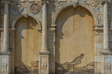 Old wall building with shadows.の写真素材