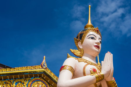 Buddha statue in front of temple usefor input text in frame picture.の写真素材