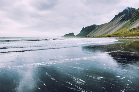 Beautiful coast of the Atlantic ocean with views of the mountains. South of Icelandの写真素材
