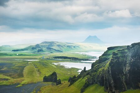 Fantastic landscape with view of the hills and mountains. South of Icelandの写真素材
