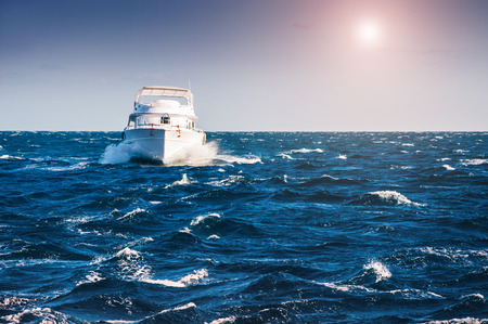 White yacht in the Red sea at sunset. Beautiful summer seascapeの写真素材